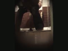 A hidden voyeur camera films stranger white wife pissing in the latrine room